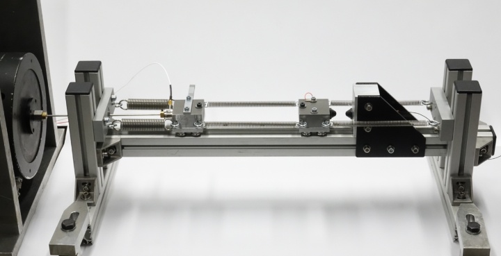 A laboratory setup of a mechanical impact oscillator